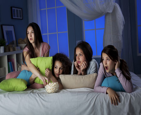 Girls watching scary films