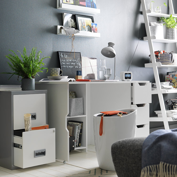 White office desk with storage stool and filing cabinets for paperwork.