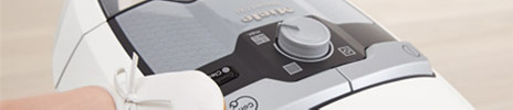 Close up image of the central area on top of a white Meili vacuum cleaner.