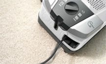 Image of the back end of a Miele vacuum cleaner showing the power controls.