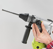 Image of someone holding an SDS drill.