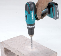 Image of someone using a combi drill to drill into brick.
