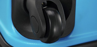 Close up image of the wheel of a suitcase.