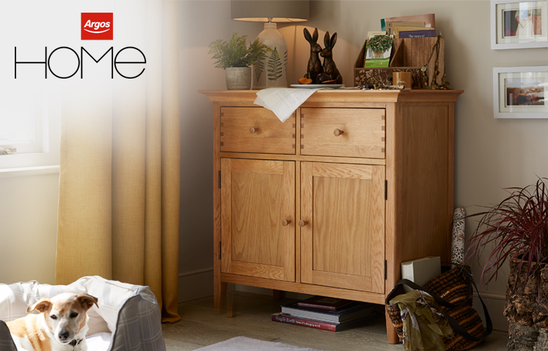 A wooden sideboard in the corner of a lounge, designed my our Argos Home product designer Stephen.