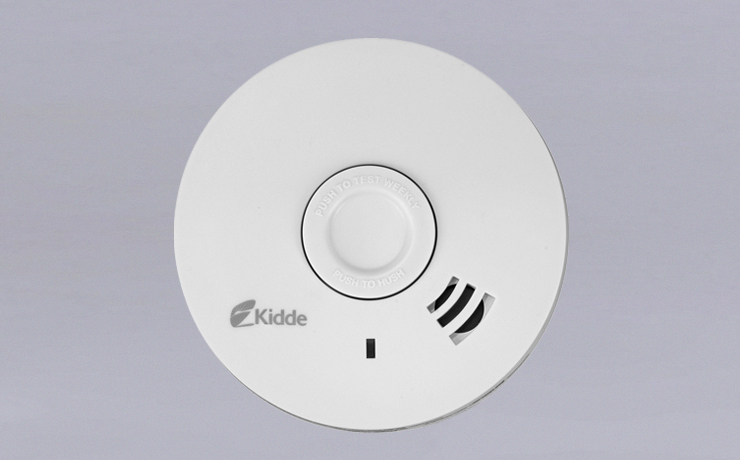 Smoke detector with house and blueprints