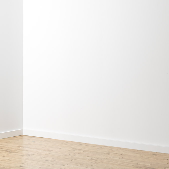 Plain white wall in children's bedroom.