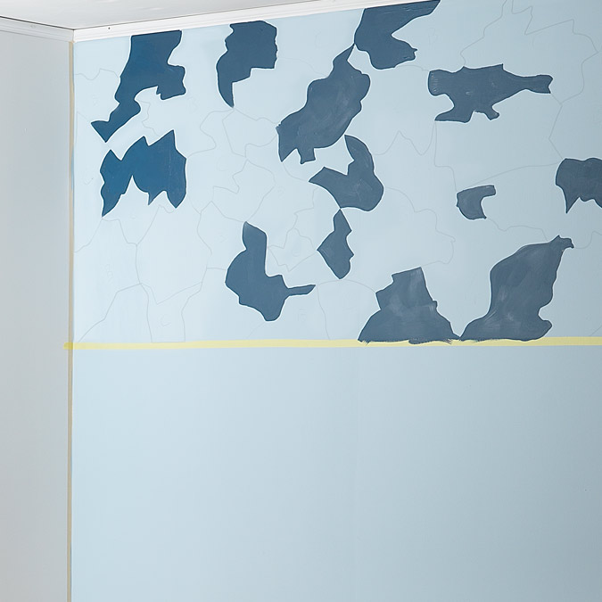 Pencil drawn camouflage design with dark blue painted sections.