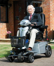 Man driving Quingo scooter.