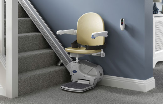 Age UK Stairlift with beige seat.