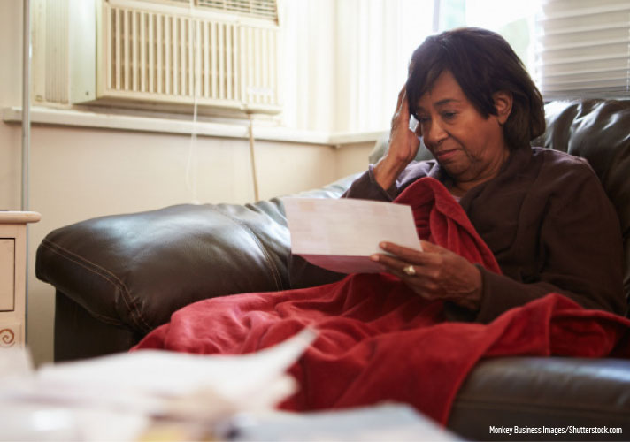 Woman reading her energy bill