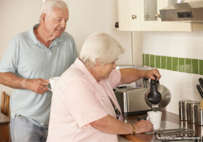 Couple pouring a cup of tea