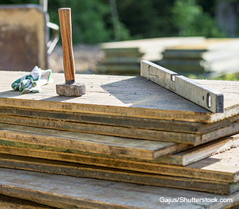 Assortment of wooden panels with hammer and spirit level