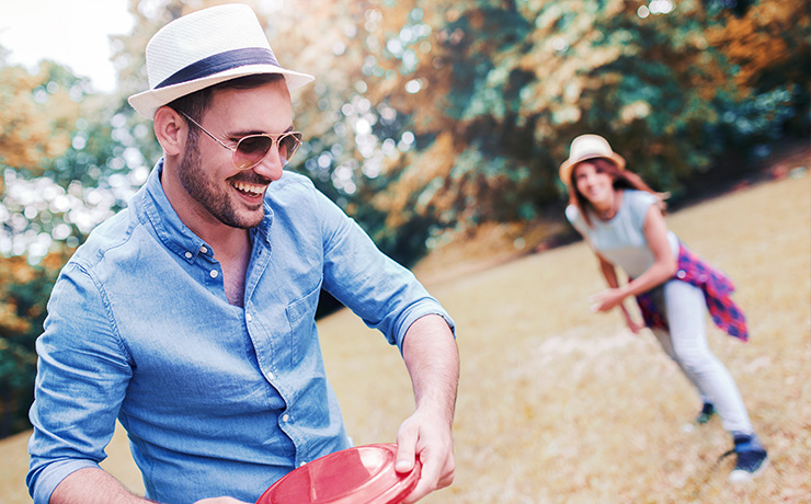 Image of a man and woman playing cricket