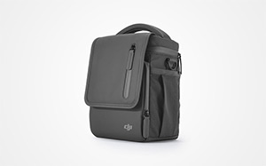 Image of the bottom half of a person holding a DJI drone bag.