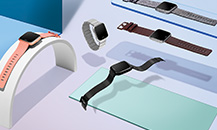 Image of Fitbit watches and Flyer earphones placed on metal display plates.