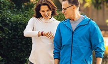 Couple walking down a street.