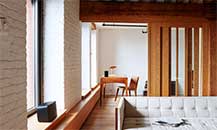 Image of a room with a Sonos speaker on the windowseal and another on a desk in the background.