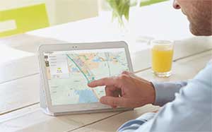 Image of a man planning a route on a tablet device.