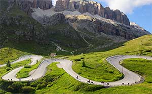 Image of a mountain landscape with a winding road.