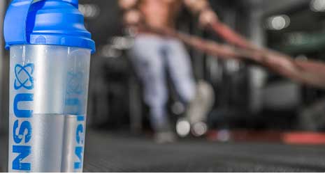 Image of a USN drinks bottle infront of a blured background.